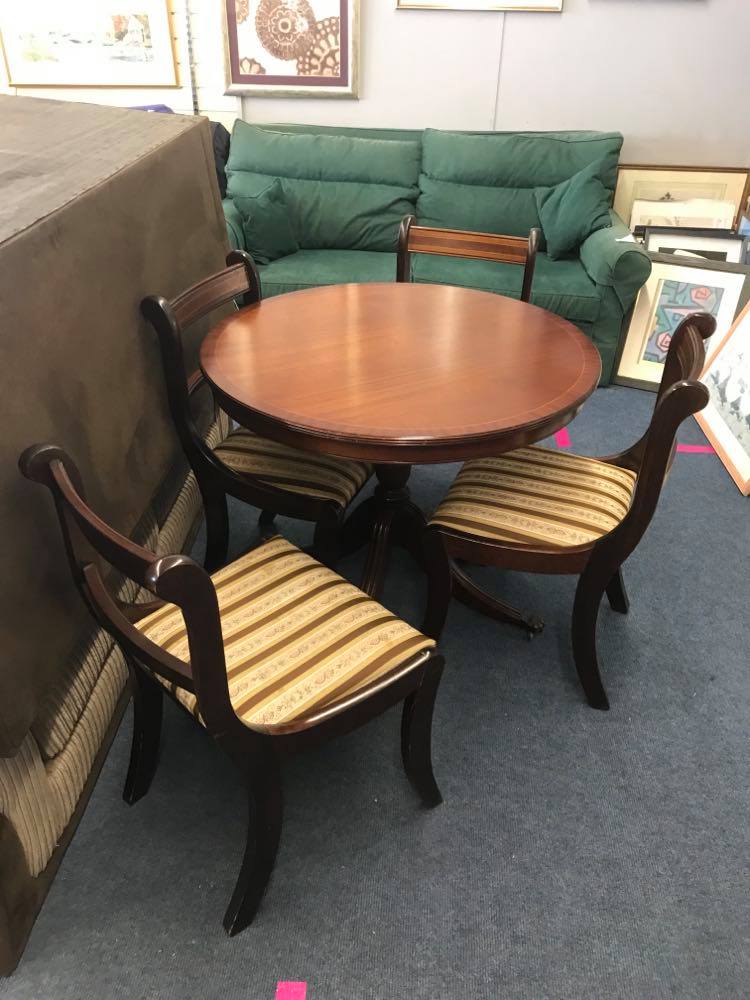 Circular tilt top dining table and 4 chairs in very good condition
